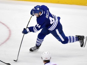 Toronto Maple Leafs defenceman Morgan Rielly shoots the third period of the Leafs 6-3 loss to New York Islanders at Air Canada Centre. (Dan Hamilton/USA TODAY Sports)