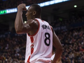 Toronto Raptors' Bismack Biyombo flexes after winning a contested rebound during the Raptors 104-94 win over Charlotte Hornets in NBA basketball action in Toronto on Friday January 1, 2016. (THE CANADIAN PRESS/Chris Young)