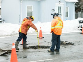 Star Staff
Contractors work to repair a collapsed manhole on Elm Street, between Ethelbert and Big Nickel Road, on Thursday morning. Traffic was reduced to two lanes for the better part of the day while the hole was filled in.