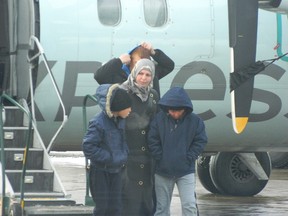 The Qarqoz family of Syria arrive at the Greater Sudbury Airport on Dec. 31.
