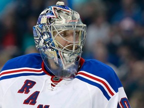 Henrik Lundqvist's numbers have steadily dropped each of the first three months. Is it his fault, or the team's man-to-man defensive coverage? (USA Today Sports)