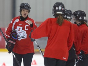 Canadian Olympic and world champion women's hockey player Cassie Campbell-Pascall, left, directs players during a Women's HockeyFest in Winnipeg last month.