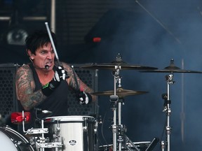 Tommy Lee performs with Motley Crue in this file photo. (WENN.COM)