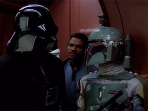 Darth Vader and Boba Fett are pictured in The Empire Strikes Back. Jason Wingreen, who provided the voice of Star Wars bounty hunter Boba Fett in The Empire Strikes Back, has died at age 95. (YouTube screengrab)