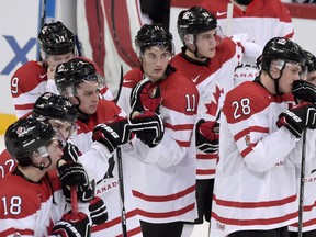 Dejected Canadian players after losing to Canada in a world junior championship quarter-final match against Finland in Helsinki on Jan. 2, 2016. (Markku Ulander/Lehtikuva via AP)