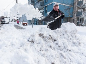 Henry McCambridge is not impressed with the city's efforts in clearing snow from around his building complex in Vanier that is populated with seniors. on Thursday December 31, 2015. Errol McGihon/Ottawa Sun/Postmedia Network