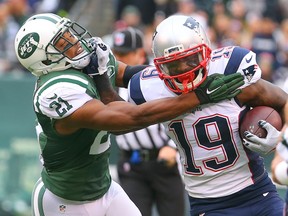New England Patriots wide receiver Brandon LaFell runs with the ball while New York Jets free safety Marcus Gilchrist attempts to tackle him during the first half at MetLife Stadium in East Rutherford, N.J., on Dec. 27, 2015. (Ed Mulholland/USA TODAY Sports)