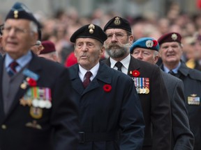 Canadian Veterans march to Remembrance Day ceremonies at the National War Memorial  on Wednesday, November 11, 2015. 
THE CANADIAN PRESS/Adrian Wyld