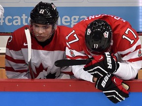 Canada's John Quenneville (22) and Travis Konecny (17) react to their team's loss against Finland following quarter-final hockey action at the IIHF World Junior Championship, in Helsinki, Finland, on Saturday, Jan. 2, 2016. THE CANADIAN PRESS/Sean Kilpatrick