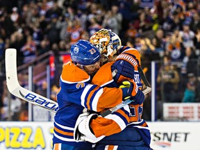 Edmonton's Matt Hendricks (23) and goalie Cam Talbot (33) hug after winning the game during the shoot out of the Edmonton Oilers' NHL hockey game against the Arizona Coyotes at Rexall Place in Edmonton, Alta., on Saturday, Jan. 2, 2016. The Oilers won 4-3. Codie McLachlan/Edmonton Sun/Postmedia Network