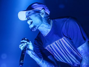 In this Friday, Dec. 18, 2015 file photo, Chris Brown performs at the Hollywood Palladium in Los Angeles. (Photo by Rich Fury/Invision/AP, File)