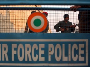 An Indian security personnel stands guard next to a barricade outside the Indian Air Force (IAF) base at Pathankot in Punjab, India, January 2, 2016.  REUTERS/Mukesh Gupta