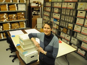 Acting Archivist Amanda Hill stand in a room, with shelves stacked with Intelligencer pages, at the soon to be closed Cannifton-based Heritage Centre. Hill his spearheading the relocation of the delicate files to its new home at the Belleville Public Library.
