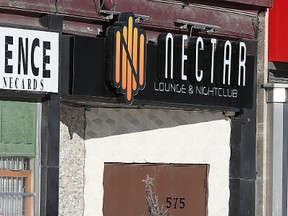 A pedestrian walks past Nectar Nightclub at 575 Portage Ave. in Winnipeg on Sun., Jan. 3, 2015. A 31-year-old man faces a number of charges including attempted murder following an alleged domestic altercation that police say began outside the club in the early hours of Jan. 1. (Kevin King/Winnipeg Sun/Postmedia Network)