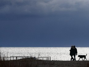 A couple takes a walk near Kew Beach on Sunday January 3, 2016. Dave Abel/Toronto Sun