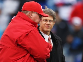 Head Coach Andy Reid of the Kansas City Chiefs and Kansas City Chiefs owner Clark Hunt during the first half at Ralph Wilson Stadium on November 9, 2014 in Orchard Park, New York.   Tom Szczerbowski/Getty Images/AFP
