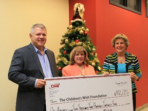 From left: Glen Demetrioff (DMT), Maria Toscano (Children’s Wish Foundation), Sharon Demetrioff (DMT). For the second consecutive year, DMT presented Children's Wish with the largest corporate donation in the chapter's history.