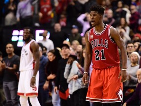 Chicago Bulls' Jimmy Butler celebrates a three-point basket against the Toronto Raptors during second half NBA basketball action in Toronto on Sunday, Jan.3, 2016. THE CANADIAN PRESS/Frank Gunn