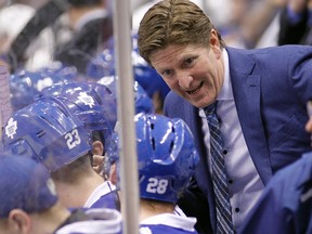 Toronto Maple Leafs head coach Mike Babcock talks to Toronto Maple Leafs forward Brad Boyes (28) on the bench during a game against St. Louis Blues at the Air Canada Centre. Toronto defeated St. Louis 4-1. John E. Sokolowski-USA TODAY Sports