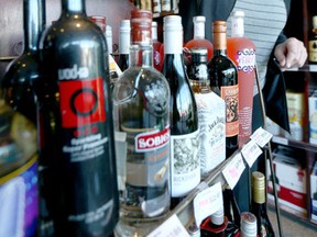 Emily Brucks, General Manager at Royal Liquor Merchants (Haysboro) examines product in the Calgary, Alta store on Sunday January 3, 2016. Jim Wells/Calgary Sun/Postmedia Network