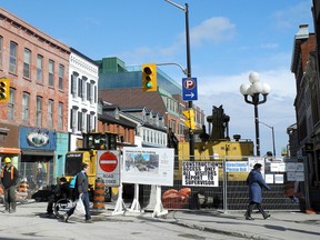 Pedestrians make their way across Princess Street as the Big Dig closes  Princess Street at Wellington Street in 2013. (Whig-Standard file photo)
