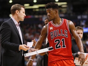Chicago Bulls head coach Fred Hoiberg talks with guard Jimmy Butler during a timeout on Jan. 3, 2016. Hoiberg described Butler’s 42-point performance as “unbelievable.” (JOHN E. SOKOLOWSKI/USA Today Sports)