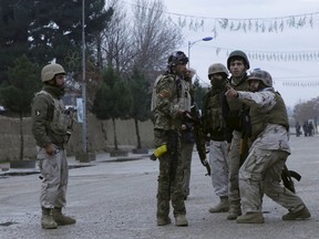 Members of Afghan Quick Reaction Force (QRF) talk among themselves during an operation near the Indian consulate in Mazar-i-Sharif, Afghanistan January 4, 2016. Afghan special forces prepared to clear insurgents barricaded in a house near the Indian consulate in the northern city of Mazar-i-Sharif on Monday after an overnight attack that coincided with an assault on an Indian air base near the border with Pakistan. REUTERS/Anil Usyan