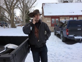 Ryan Bundy talks on the phone at the Malheur National Wildlife Refuge near Burns, Ore., Sunday, Jan. 3, 2016. Bundy is one of the protesters occupying the refuge to object to a prison sentence for local ranchers for burning federal land. (AP Photo/Rebecca Boone)