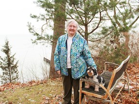 Jane Danic and her pet dog outside of her Sarnia home. Danic received a Liberal and Visual Arts Certificate from Lambton College at the age of 82. (Carl Hnatyshyn, Postmedia Network)