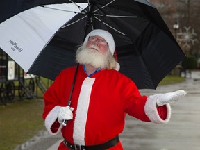Santa Claus was surprised by the mild December weather. "We've got six feet of snow back home at the North Pole," he chuckled. (DEREK RUTTAN, Postmedia Network)