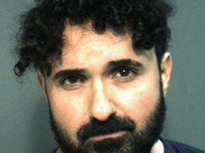 Frederick Torres, a recently fired caricature artist at Universal Orlando Resort, tried to kill his manager by stabbing him in the neck with scissors on New Year's Day at the Islands of Adventure park, according to a police report released Monday. (Orange County Sheriff's Office via AP)