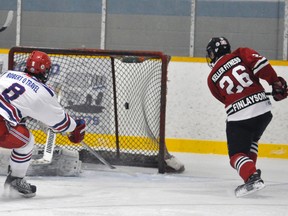 Mitchell Hawks’ Jake Finlayson (26) fires the puck into an open net after a perfect pass from Garrett James (11) during Western Jr. C hockey league action Dec. 30 against the visiting Kincardine Bulldogs. Unfortunately it wasn’t enough for the Hawks in a 4-3 overtime loss. ANDY BADER/MITCHELL ADVOCATE