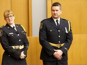 Emily Mountney-Lessard/The Intelligencer
Belleville Police Chief Cory MacKay speaks about Inspector Michael Callaghan, right, during his swearing-in ceremony on Monday in Belleville.
