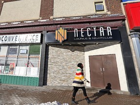 A pedestrian walks past Nectar Nightclub at 575 Portage Ave. in Winnipeg on Sun., Jan. 3, 2015. A 31-year-old man faces a number of charges including attempted murder following a domestic altercation that began outside the club in the early hours of Jan. 1. (Kevin King/Winnipeg Sun)