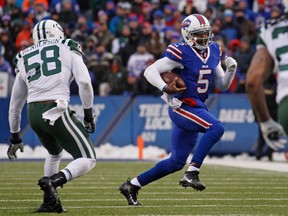 Bills quarterback Tyrod Taylor (5) runs with the ball as Jets linebacker Erin Henderson (58) pursues during second half NFL action in Orchard Park, N.Y., on Sunday, Jan. 3, 2016. (Kevin Hoffman/USA TODAY Sports)