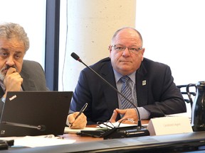 Mayor Brian Bigger and his lawyer Jack Siegel listen to proceedings on Monday January 4, 2016. The election compliance audit committee met at Tom Davies Square after Bernard Garner filed a complaint against Bigger on Dec. 7, citing alleged violations to several sections of the Municipal Elections Act. Gino Donato/Sudbury Star/Postmedia Network