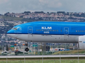 KLM flight lands on the new runway at the Calgary International Airport in this July 21, 2014 file photo. (Al Charest/Calgary Sun/Postmedia Network)