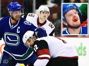 Vancouver Canucks forward Henrik Sedin (33) faces off against Arizona Coyotes forward Brad Richardson (12) during the first period at Rogers Arena. Anne-Marie Sorvin-USA TODAY Sports
