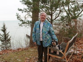 Jane Danic and her pet stand outside of her Sarnia home. Danic, a renowned potter, recently received Liberal and Visual Arts Certificate from Lambton College in the spring of 2015 at the age of 82. 
CARL HNATYSHYN/SARNIA THIS WEEK
