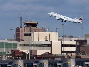 An Air Canada passenger jet takes off from Halifax on January 21, 2013. Air Canada has asked the Supreme Court to intervene to overturn a court ruling that requires the carrier to keep maintenance operations in the country. (THE CANADIAN PRESS/Andrew Vaughan)