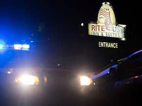 Police work the scene of a standoff at the Rite4Us Inn and Suites on Snapfinger Woods Drive, in Decatur, Ga., on Jan. 5, 2016. (Branden Camp/Atlanta Journal-Constitution via AP)