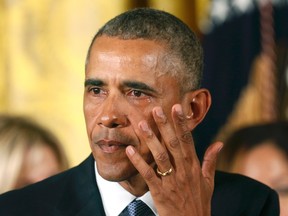 U.S. President Barack Obama wipes away a tear while announcing steps the administration is taking to reduce gun violence while delivering a statement in the East Room of the White House in Washington, on Jan. 5, 2016. (REUTERS/Kevin Lamarque)