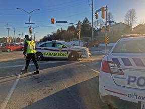 An Ottawa Paramedic unit sits, damaged in the intersection of Charlemagne Blvd. and Tenth Line Rd. in east Ottawa after being involved in a crash Tuesday afternoon. (TONY CALDWELL Ottawa Sun / Postmedia Network)