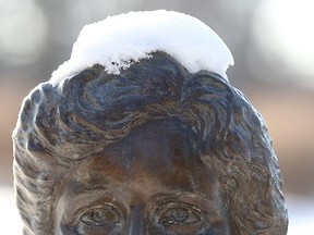 Fresh snow appears like a beanie on the head of a bronze bust of suffragette Nellie McClung in Assiniboine Park. (BRIAN DONOGH/WINNIPEG SUN FILE PHOTO)