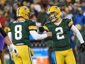 Green Bay Packers kicker Mason Crosby (2) reacts with holder Tim Masthay after kicking a field goal against the Minnesota Vikings at Lambeau Field. (Benny Sieu/USA TODAY Sports)