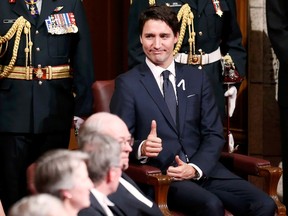 Prime Minister Justin Trudeau gives a thumbs-up ahead of the delivery of the Speech from the Throne in the Senate chamber on Dec. 4, 2015. During the election campaign, the Liberals promised to transform: the electoral system; the Senate; federal-­provincial relations; the operations of the House of Commons; the operations of the Prime Minister's Office; access to information; environmental policy as it relates to resource extraction; a century and a half of failed aboriginal policy; military procurement; immigration and refugee policy and more. REUTERS/Chris Wattie
