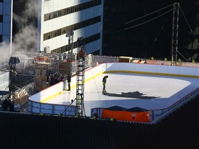 A hockey rink built on the rooftop on an Adelaide St West building in Toronto is seen Tuesday, Jan. 5, 2015. (Dave Abel/Toronto Sun)