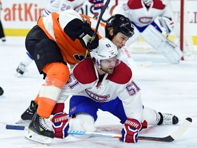 Flyers centre Ryan White (25) and Canadiens centre David Desharnais (51) battle during second period NHL action in Philadelphia on Tuesday, Jan. 5, 2016. (Eric Hartline/USA TODAY Sports)