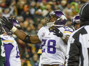 Minnesota Vikings running back Adrian Peterson (28) reacts after scoring a touchdown in the third quarter during the game against the Green Bay Packers at Lambeau Field. The Vikings beat the Packers 20-13. Benny Sieu-USA TODAY Sports