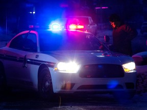 An RCMP road block in Garneau Gates as Spruce Grove RCMP investigate a shots fired call, in Spruce Grove Alta. on Tuesday Jan. 5, 2016. David Bloom/Edmonton Sun/Postmedia Network